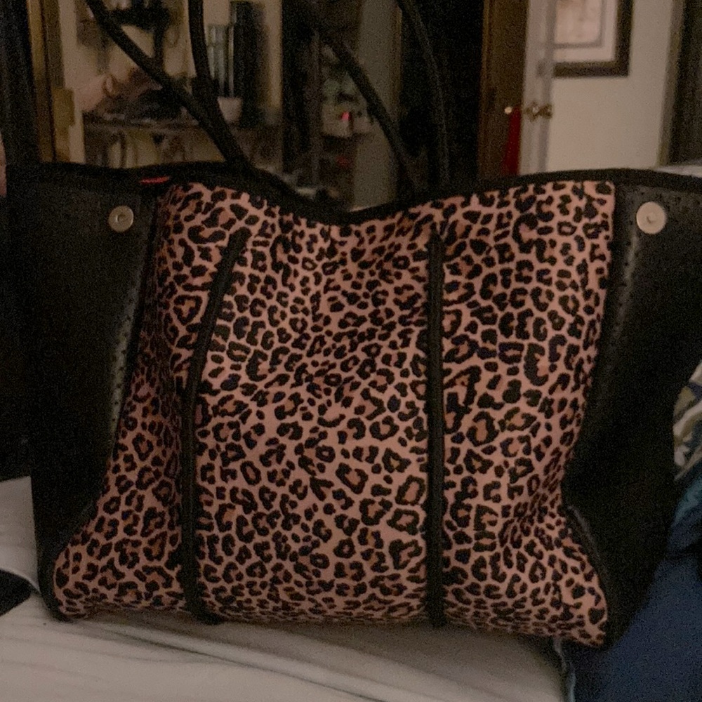 Used leopard tote adjustable in size orange inside